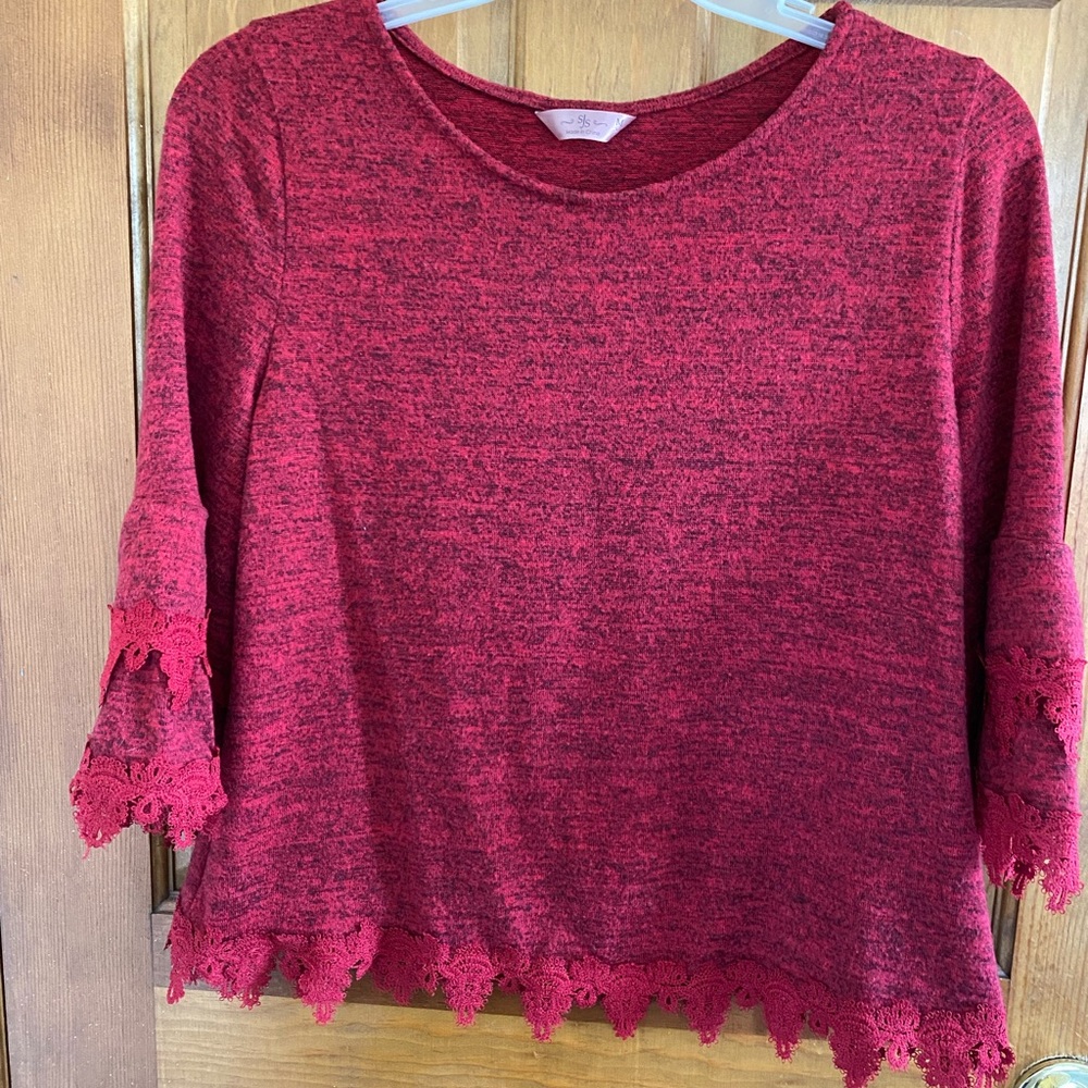 Lightweight sweater with unique pretty macrame fringe on sleeves and hem.